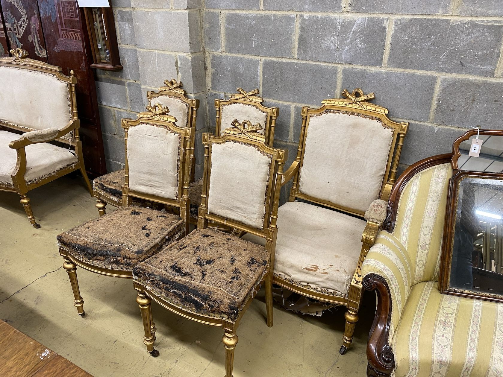 A 19th century French carved giltwood six piece salon suite, settee length 128cm, depth 53cm, height 108cm